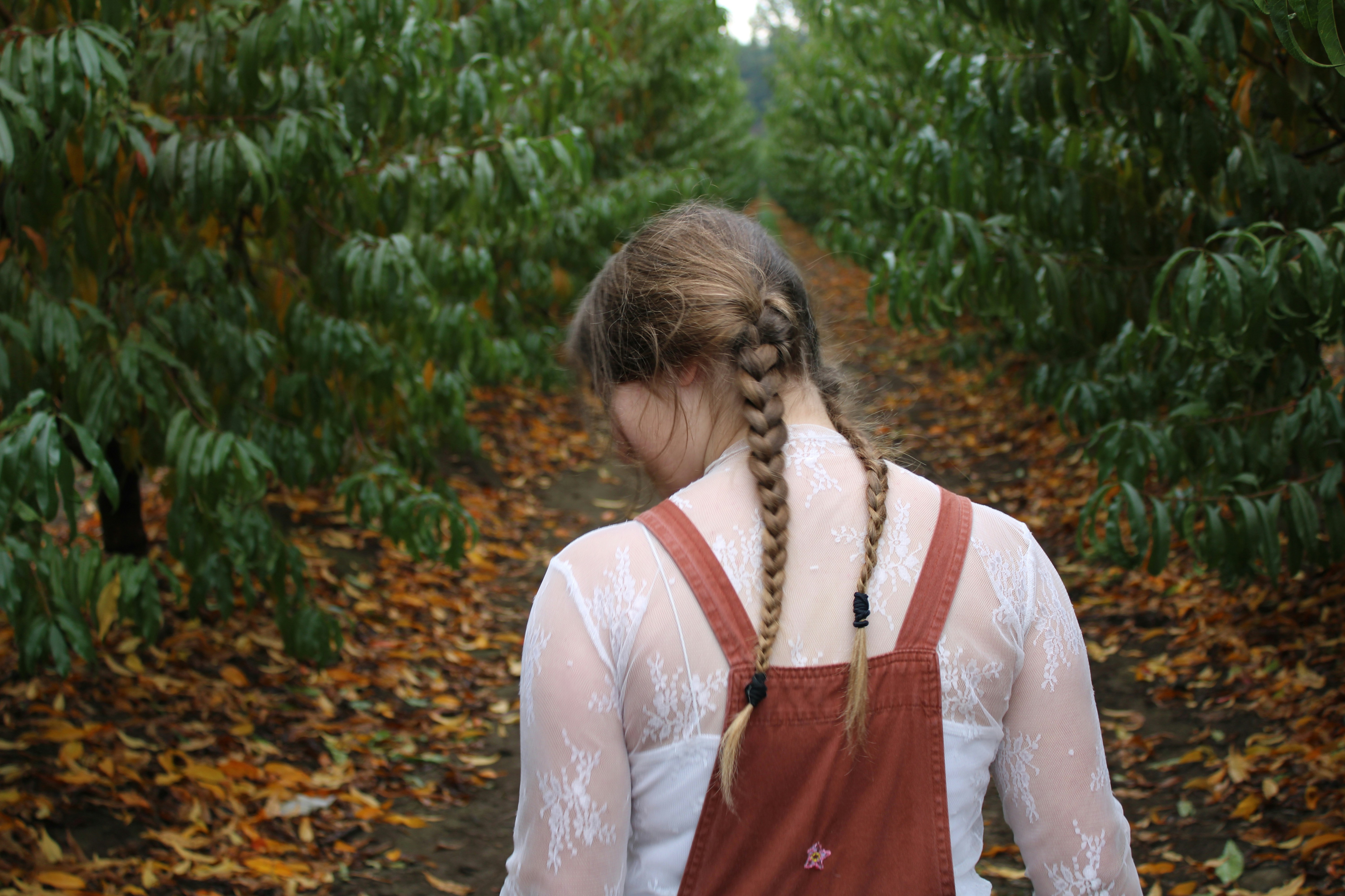 girl walking in a field